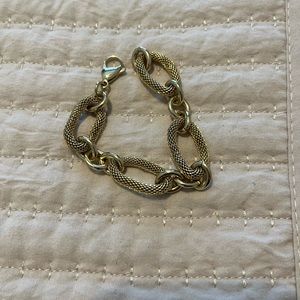 Free with purchase only, gold tone bracelet